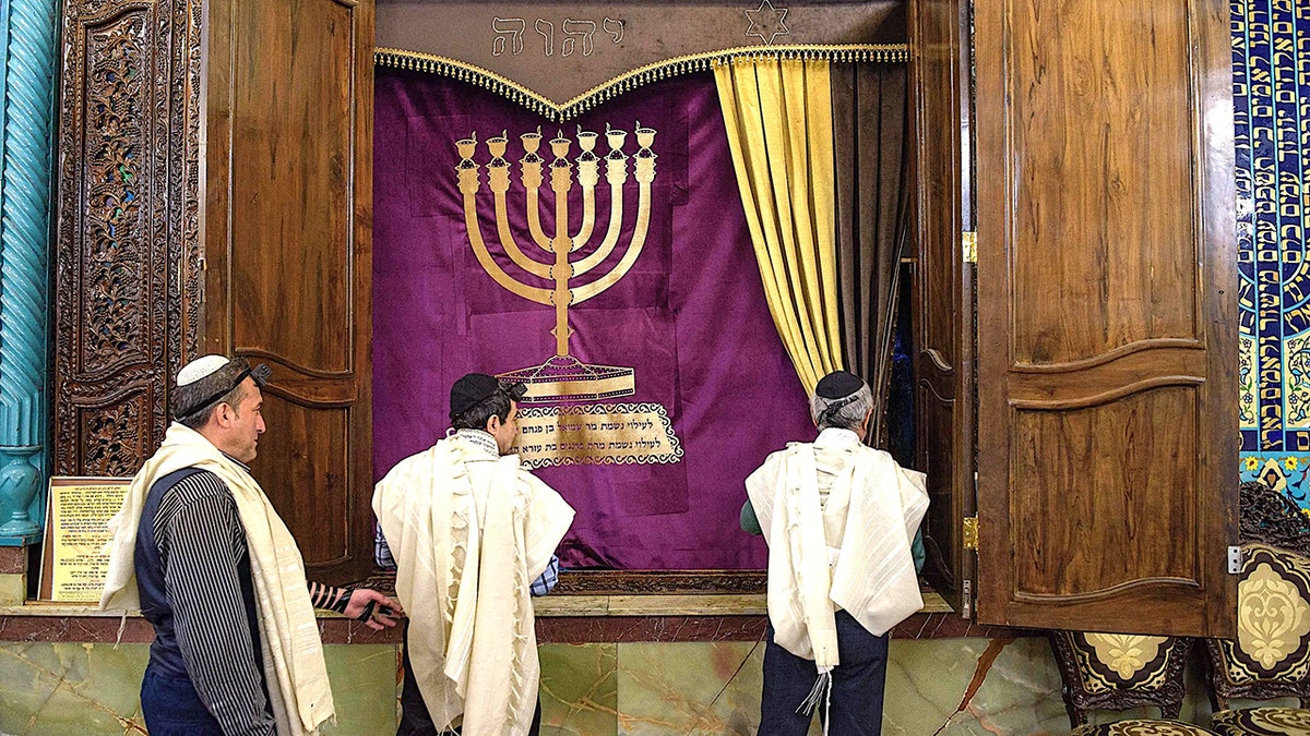 Men in synagogue in Tehran, Iran.