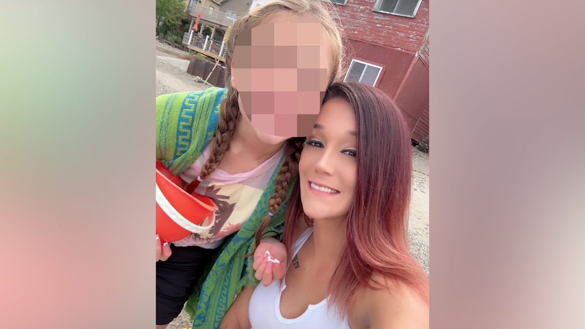 Jessica Hilliard takes a selfie with her daughter