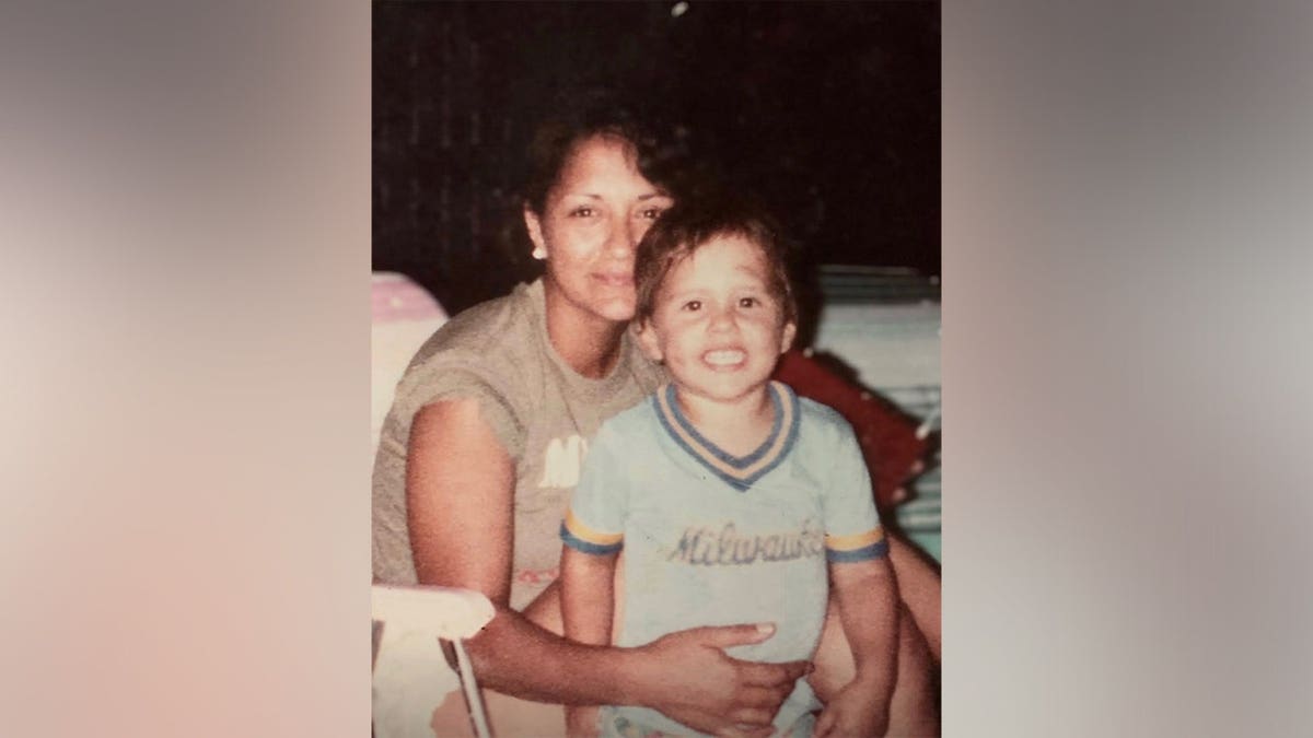 Juanita Zdroik posing for a photo with her son Zach