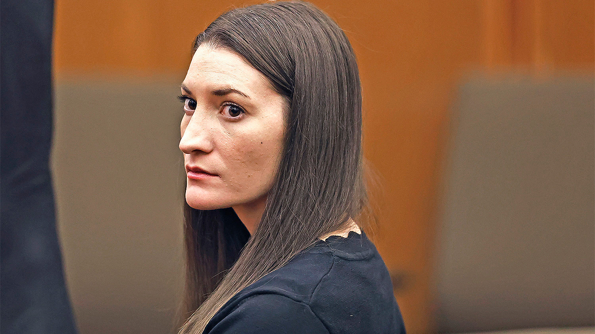 Massachusetts mother accused of killing her three children looks on during court proceedings