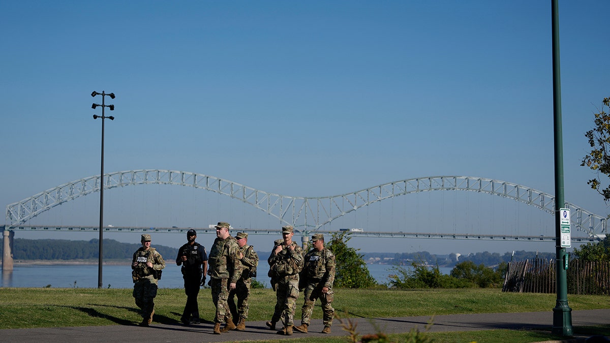 Members of the 117th Military Police Battalion and a Memphis police officer patrolling Tom Lee Park in Memphis