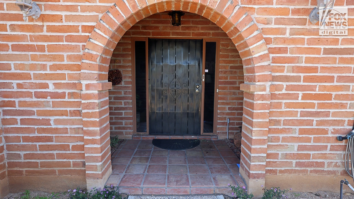 Front entrance of Nancy Guthrie's home with red droplets on the porch in Tucson, Arizona