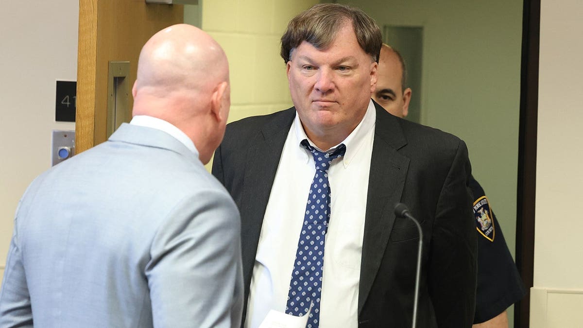 Rex A. Heuermann standing in Suffolk County Court during guilty plea hearing