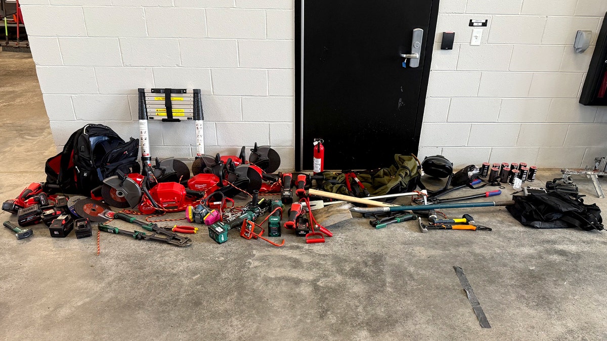 Items seized from protesters are lined up.