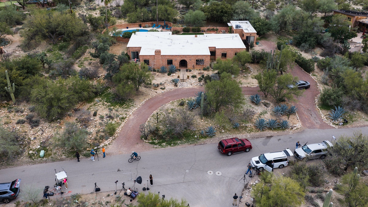 Members of the press working outside Nancy Guthrie's home in Tucson, Arizona