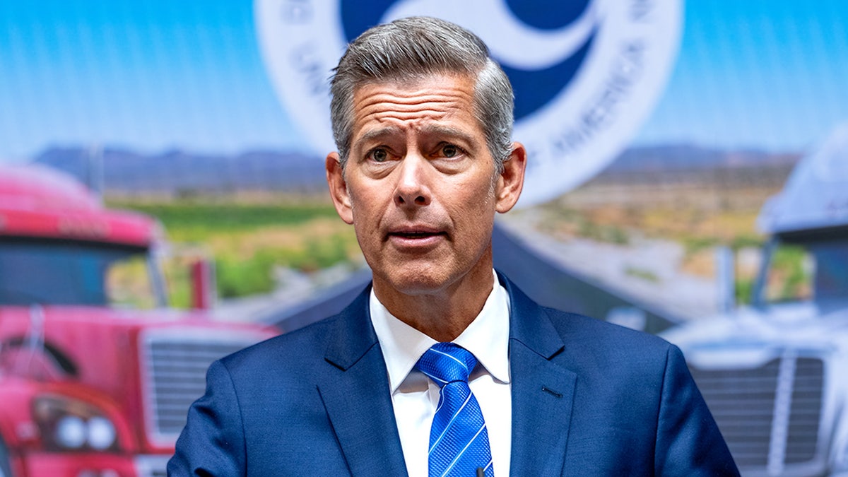 Transportation Secretary Sean Duffy speaks at a podium during a news conference.