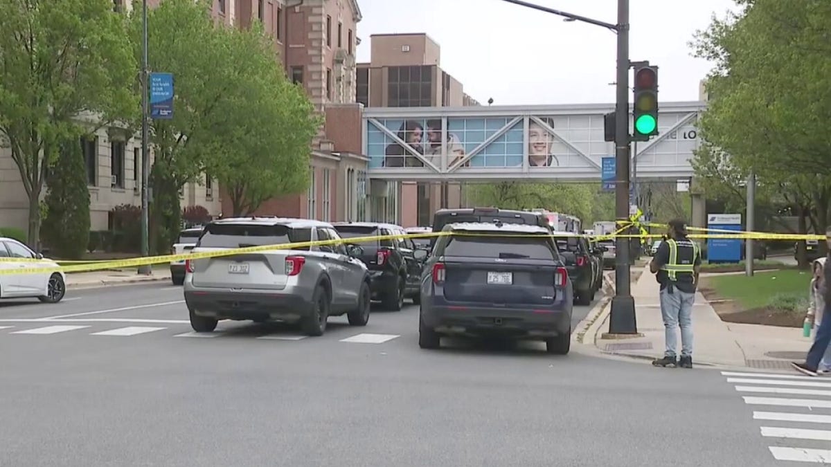 Police officers standing outside Endeavor Health Swedish Hospital in Chicago