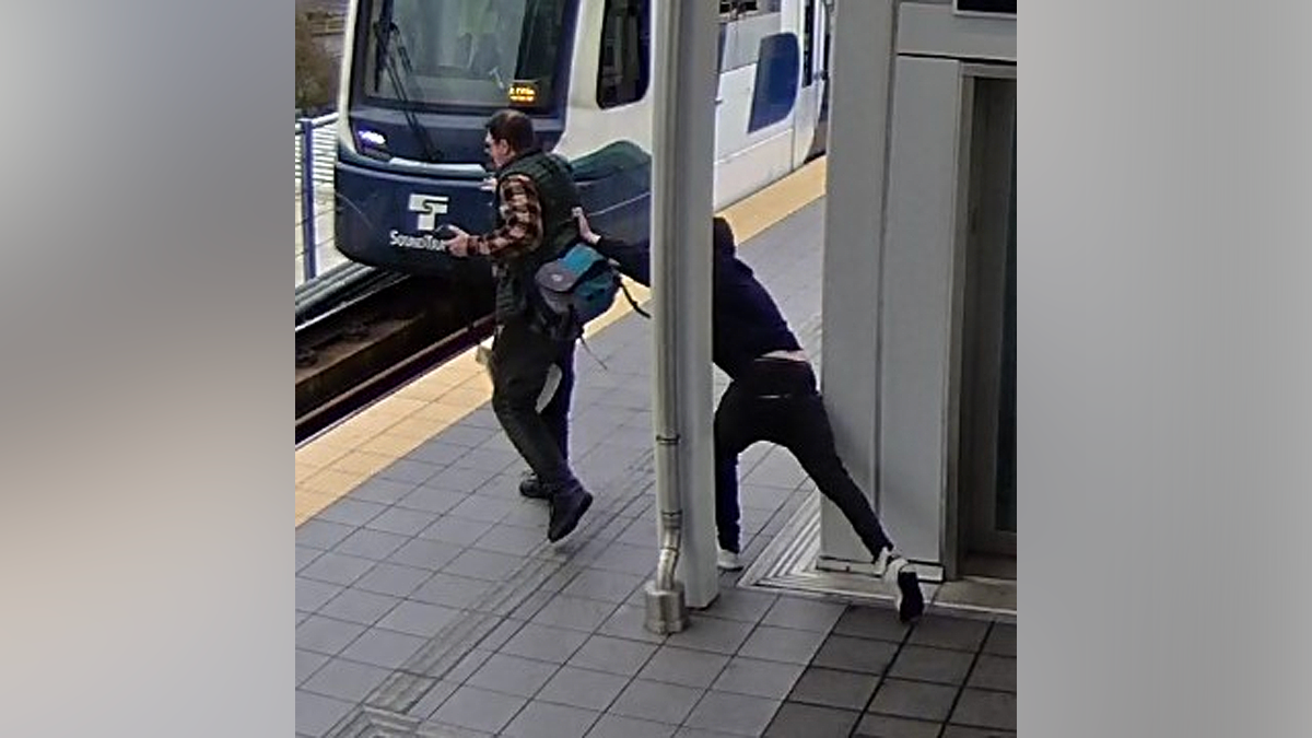 Suspect appears to push man again as train arrives at Seattle light rail platform