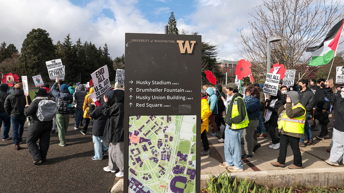 Anti-Israel protestors holding signs at the University of Washington