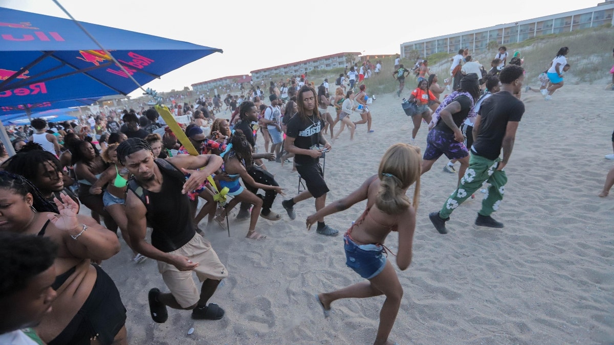 Festival goers running away from stage at Orange Crush on Tybee Island