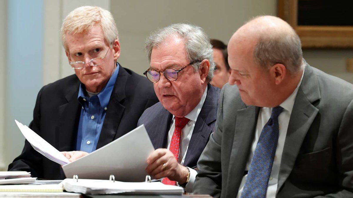 Alex Murdaugh sitting with legal team including Dick Harpootlian and Jim Griffin in courthouse