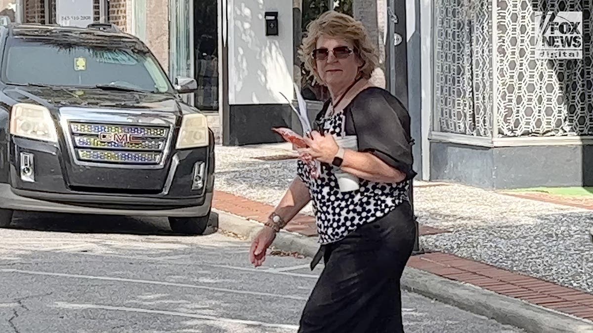 Colleton County Court Clerk Becky Hill crossing a street in Walterboro South Carolina