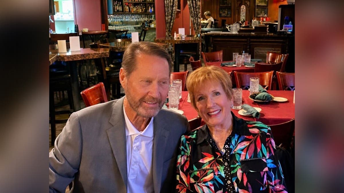 Donald and Karen Whitaker sitting at a table