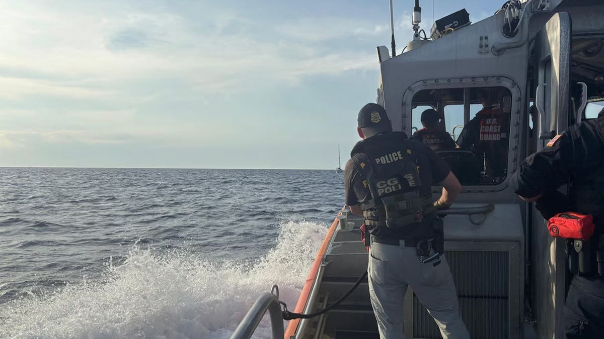 Coast Guard officials on a boat