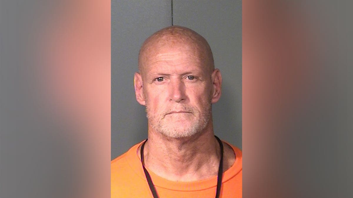 Mugshot of Arizona death row inmate Leroy Dean McGill wearing an orange prison shirt.