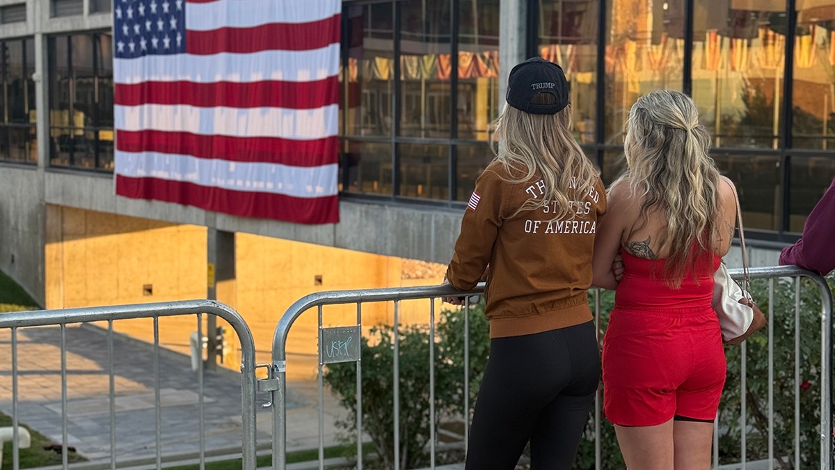 UVU students pausing and gazing over the spot where Charlie Kirk was assassinated