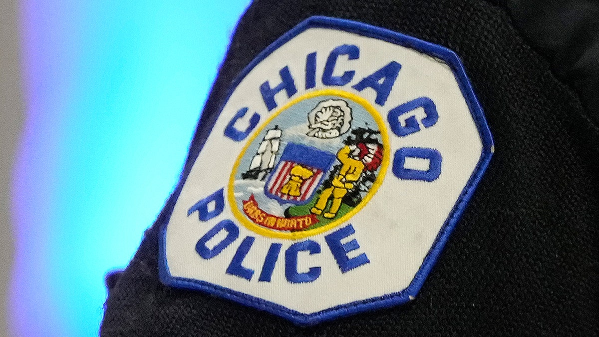 Chicago police officer wearing uniform with police patch at basketball game