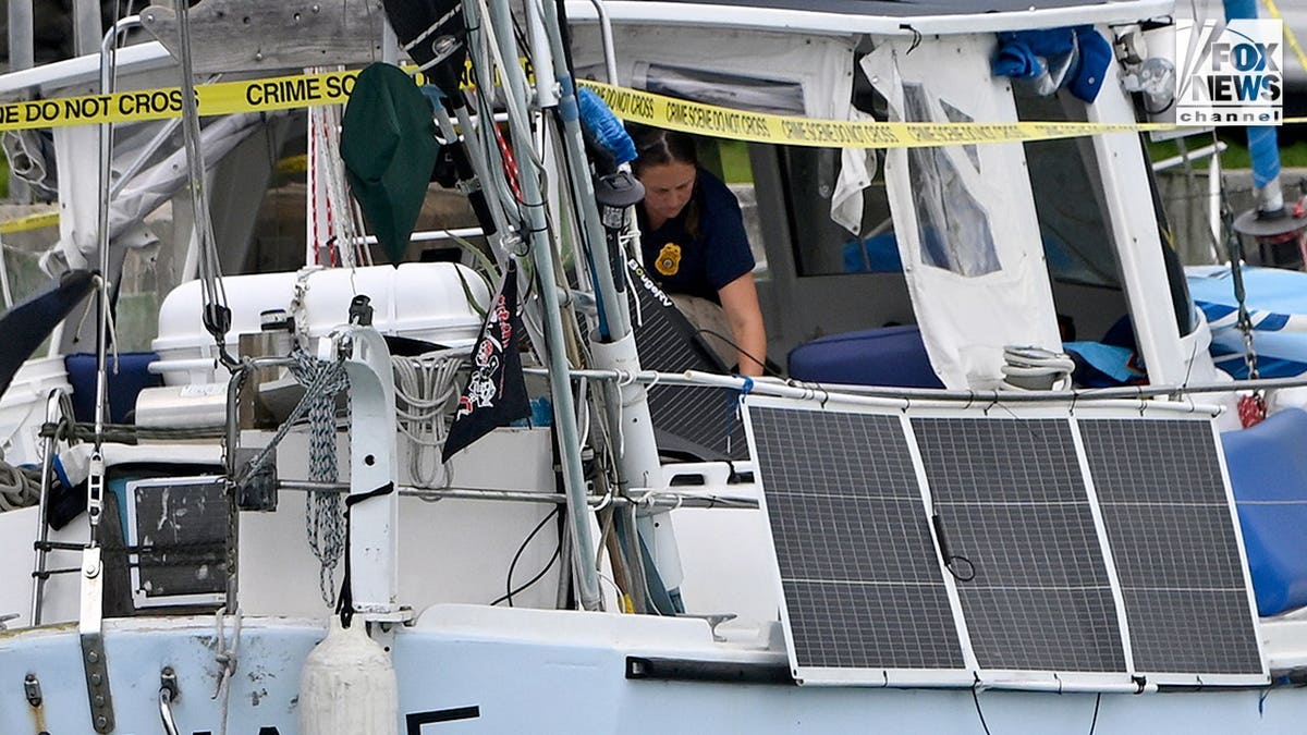 U.S. Coast Guard investigators search Brian Hooker's and his missing wife Lynette Hooker's the boat Soulmate.