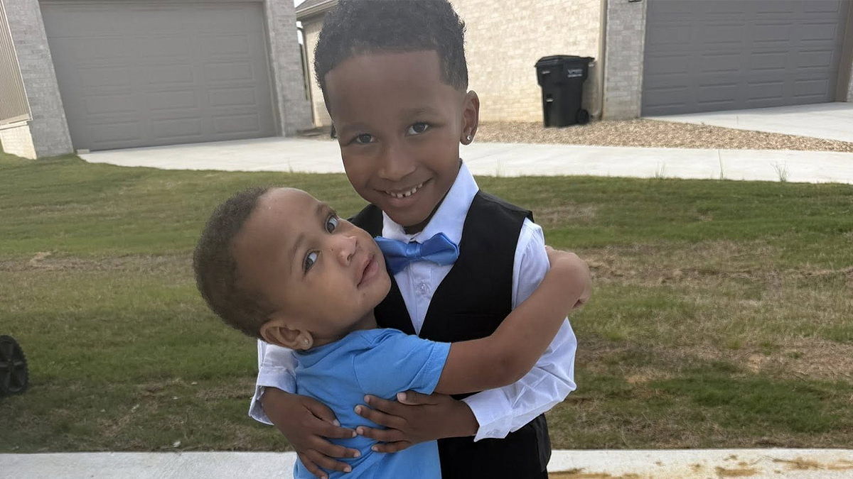 Dax Barnes and Dyce Love, young brothers killed in Arkansas crash, pictured hugging outside