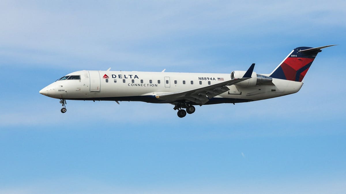 A commercial airplane approaches John F. Kennedy International Airport in New York City.
