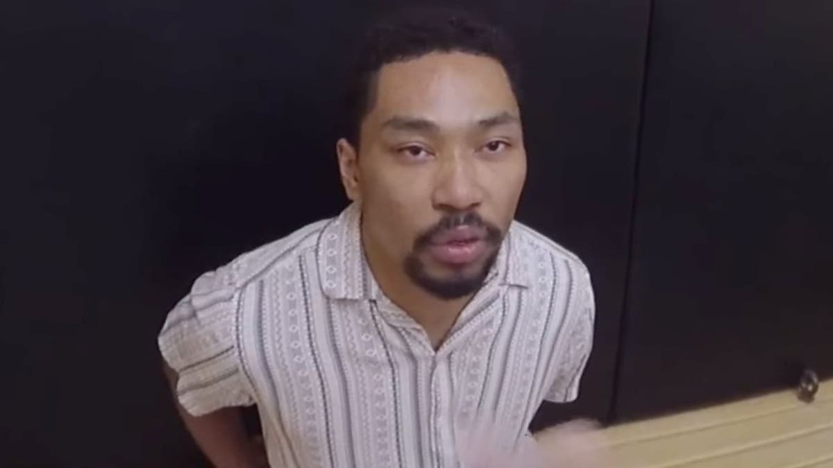 Shane Tamura standing in a police setting in Las Vegas