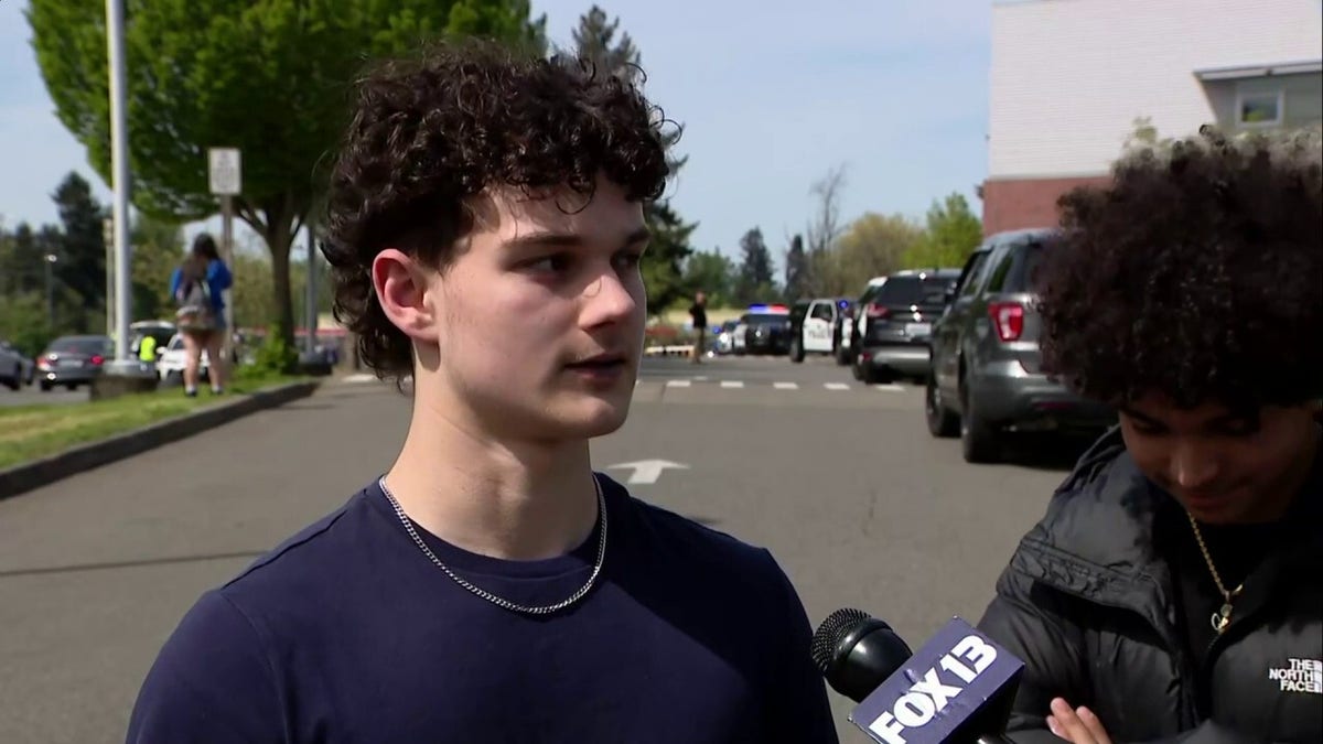 Students reacting in a school hallway at Tacoma High School