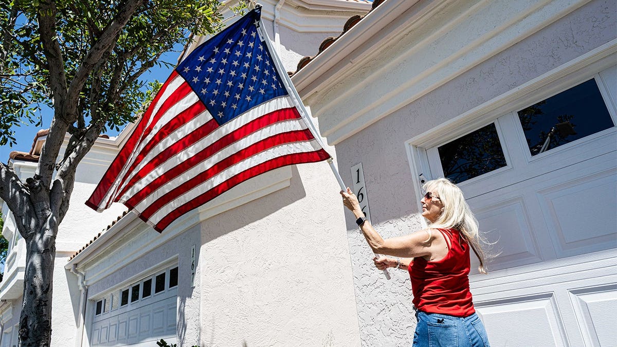 Amy Cooke holds American flag