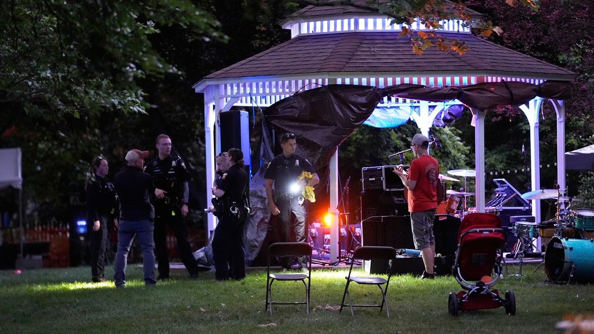 Police officers investigating shooting scene at Agnes Reynolds Jackson Arboretum in Toledo