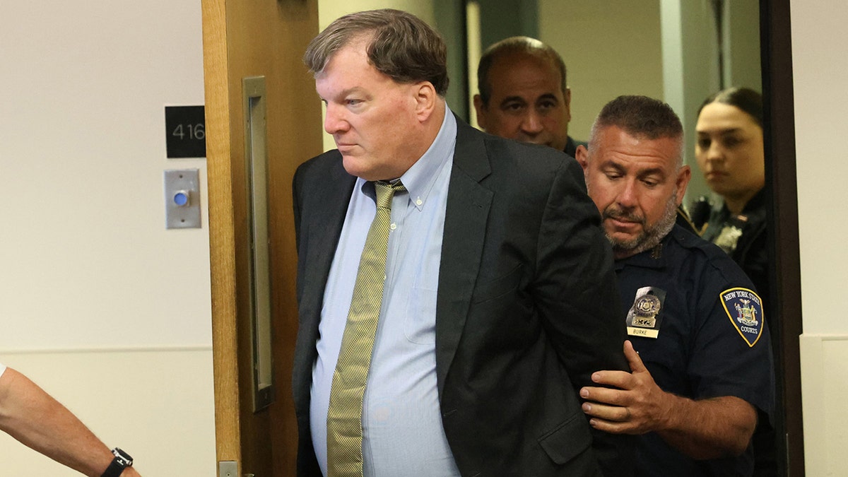 Rex Heuermann entering Suffolk County Court courtroom escorted by officers