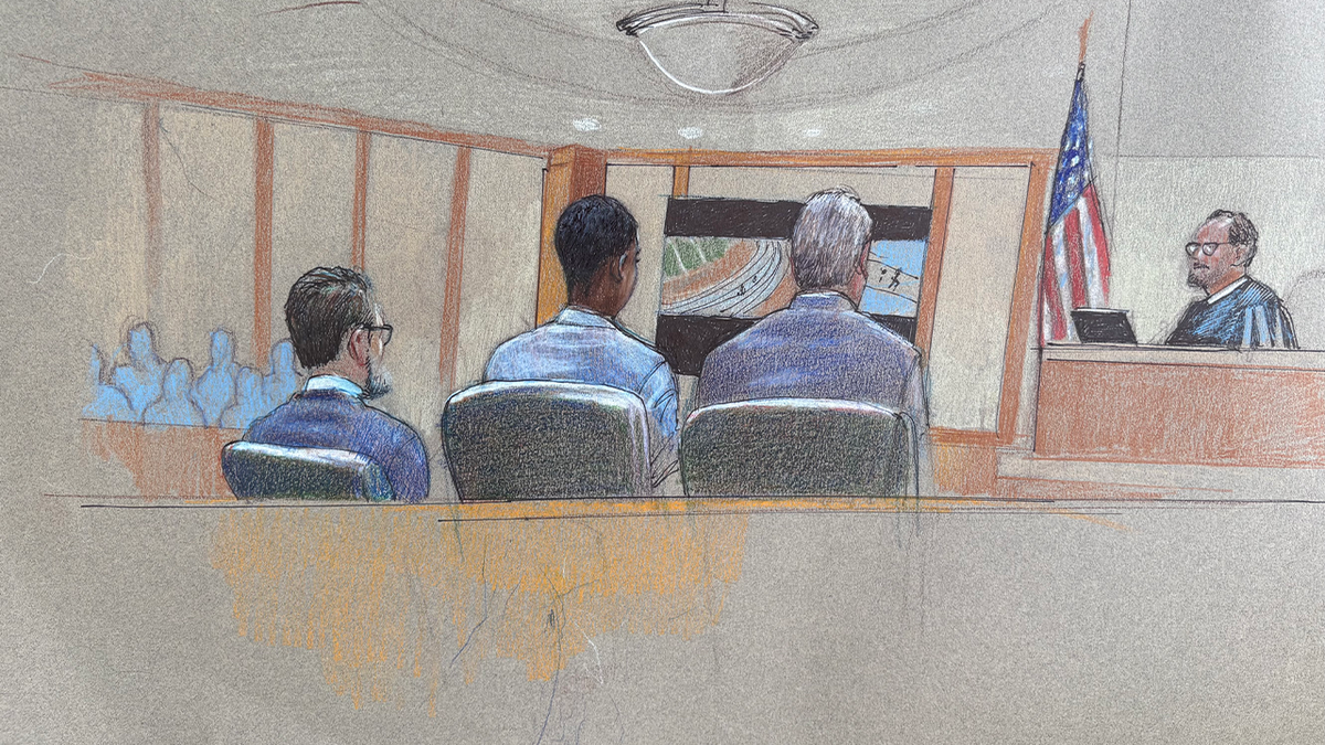 Courtroom sketch shows Karmelo Anthony seated with attorneys as surveillance video is presented during his murder trial in the fatal stabbing of Austin Metcalf at a Texas high school track meet