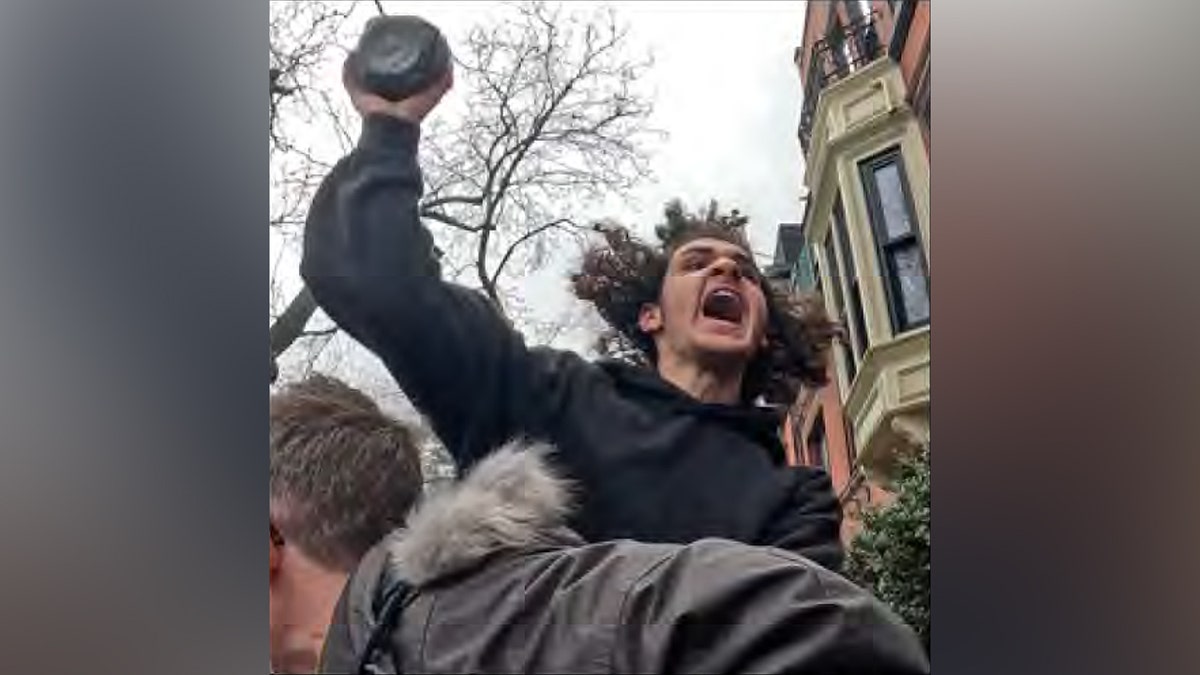 Suspect accused in ISIS-inspired terror attack raising arm during protest in New York City