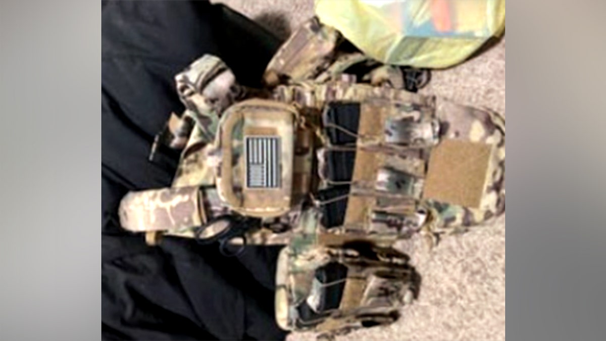 Tycen Proper's seized gear including ammunition boxes and plate carriers with AR-style magazines