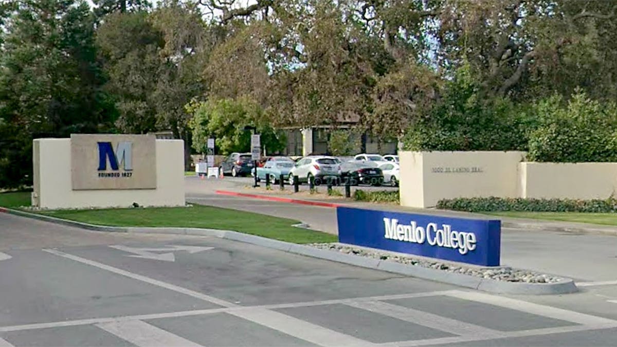 Entrance sign and driveway leading into Menlo College in Atherton, California