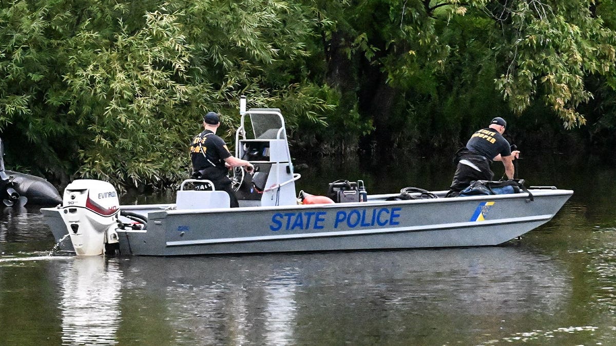 Passaic Police and other assisting towns work the scene inside of the Passaic River where a 10-year-old boy was found dead and an ongoing operation is underway to recover a 10-year-old girl after both children were in the Passaic River in the vicinity of Veterans Ct near a park in Passaic, New Jersey, United States on Thursday, July 30, 2026. Authorities canvassed the area for any clues, evidence and signs of the missing children. The investigation is active and ongoing.