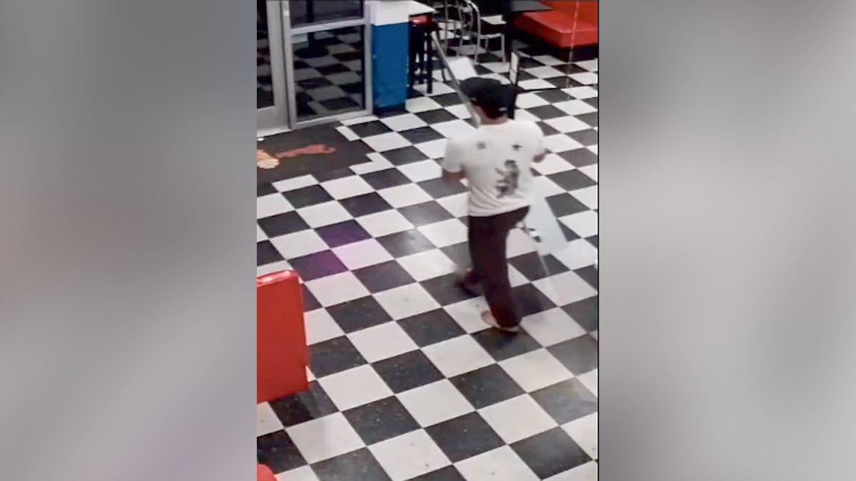 Surveillance image shows a barefoot suspect carrying a Taylor Swift cardboard cutout out of Mister Softee in Camarillo