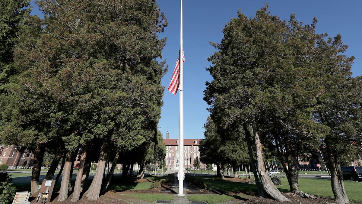 The main flag pole in front of the U.S. Army I Corps headquarters on Joint Base Lewis-McChord, south of Tacoma, Wash., hangs at half-staff, Wednesday, Dec. 5, 2018.