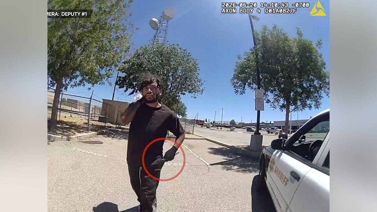 Body camera footage shows a man approaching a Los Angeles County sheriff's deputy while holding a knife in a Lancaster parking lot.