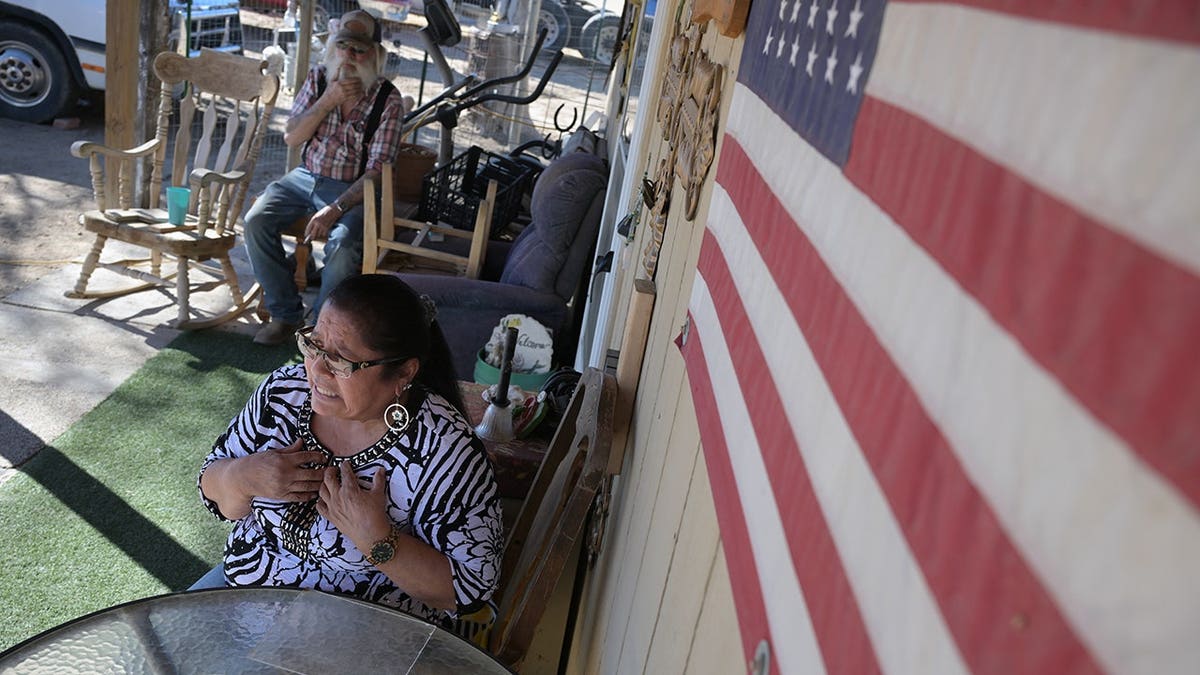Velma Cooper and Mark sit at their house in Hartman, Colo.