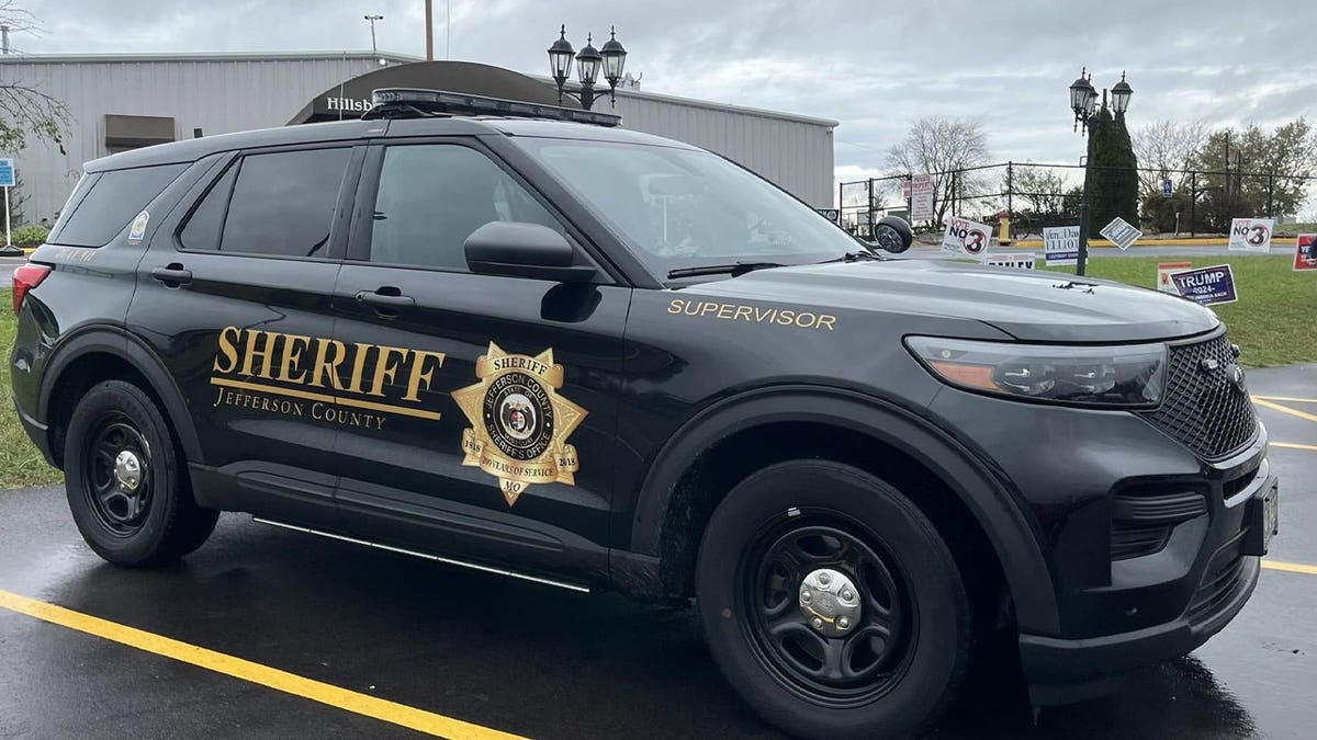 A black Jefferson County Sheriff SUV parked in a lot on an overcast day.