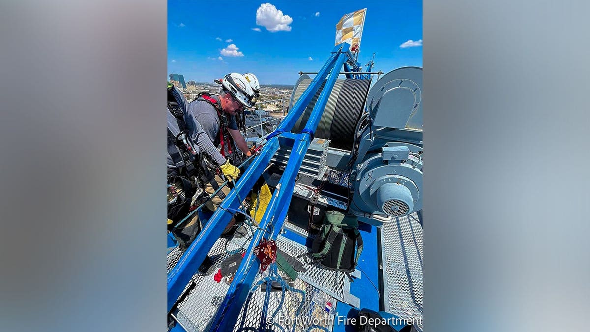 The Fort Worth Fire Department shared photos in a Facebook post that described a rescue operation to lower an individual from a towering crane.