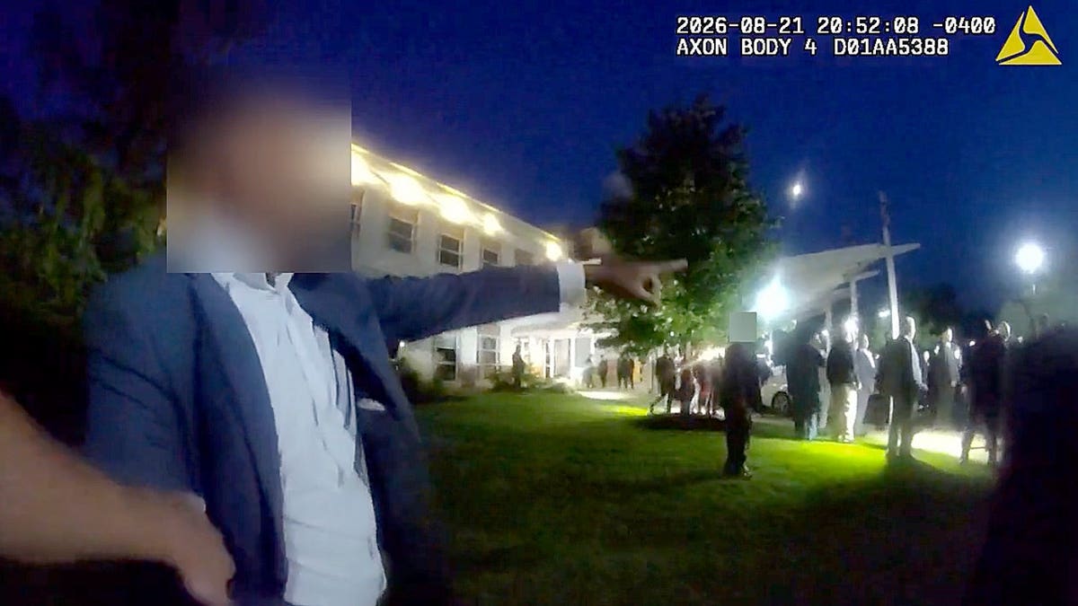 Body-camera footage shows a wedding guest pointing toward a crowd outside an Ohio banquet hall as police respond to a fight.