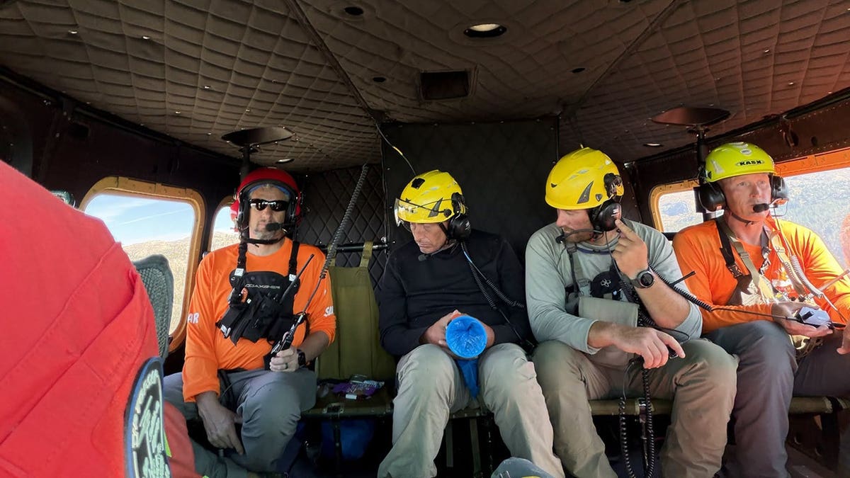rescuers sitting in helicopter