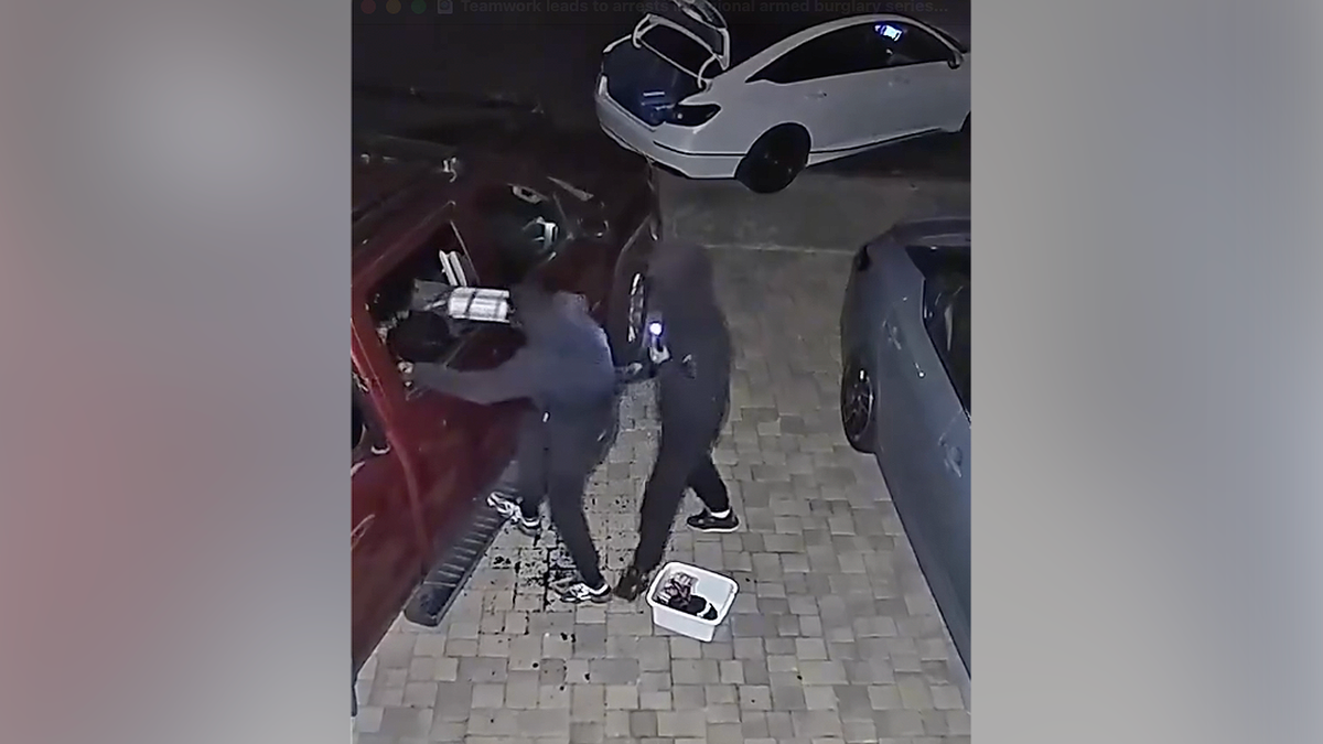 Surveillance captures suspects breaking into parked truck