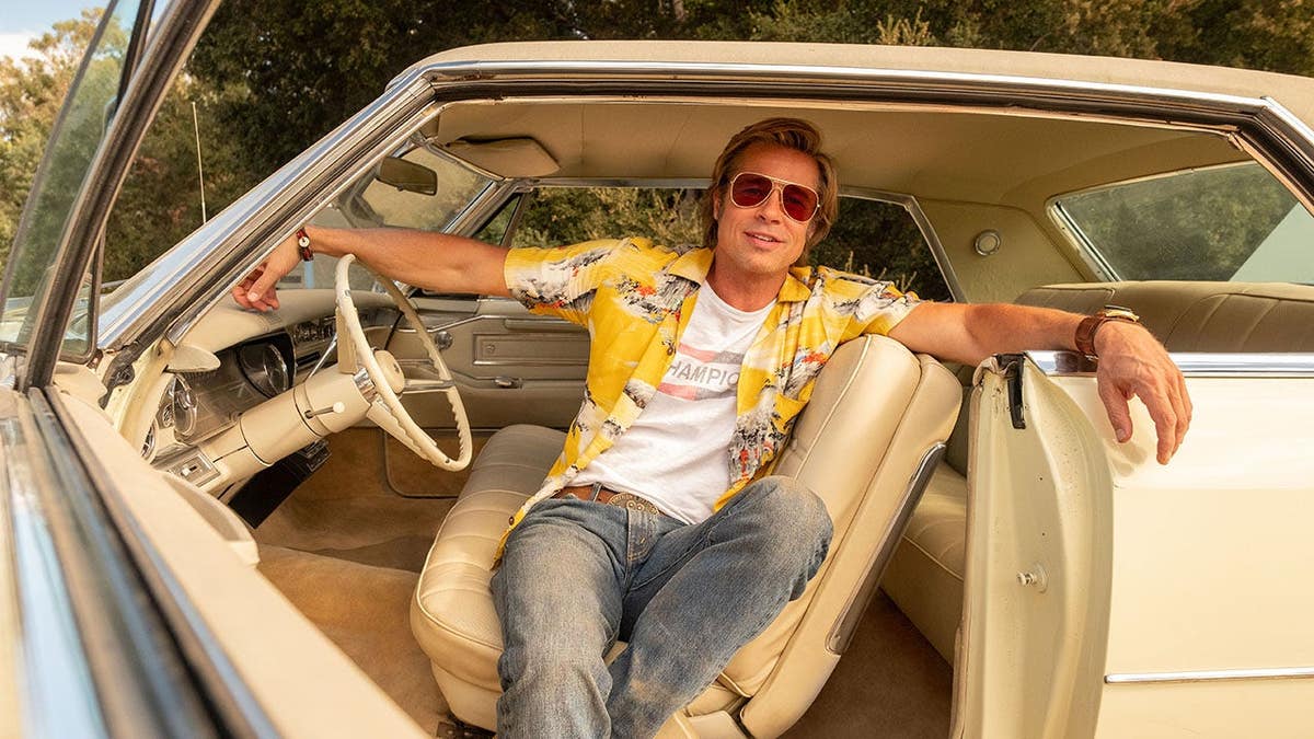 Brad Pitt stands in a scene from Once Upon a Time in Hollywood.