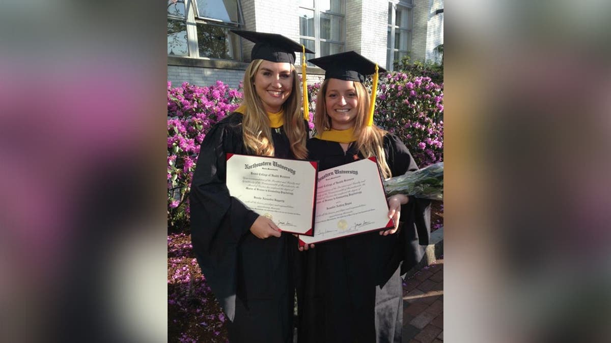Brooke Hanlon and Jennifer Payne pose together after graduating from Northeastern University.