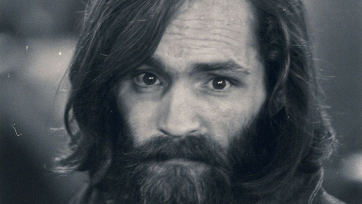 Charles Manson in a portrait photograph.