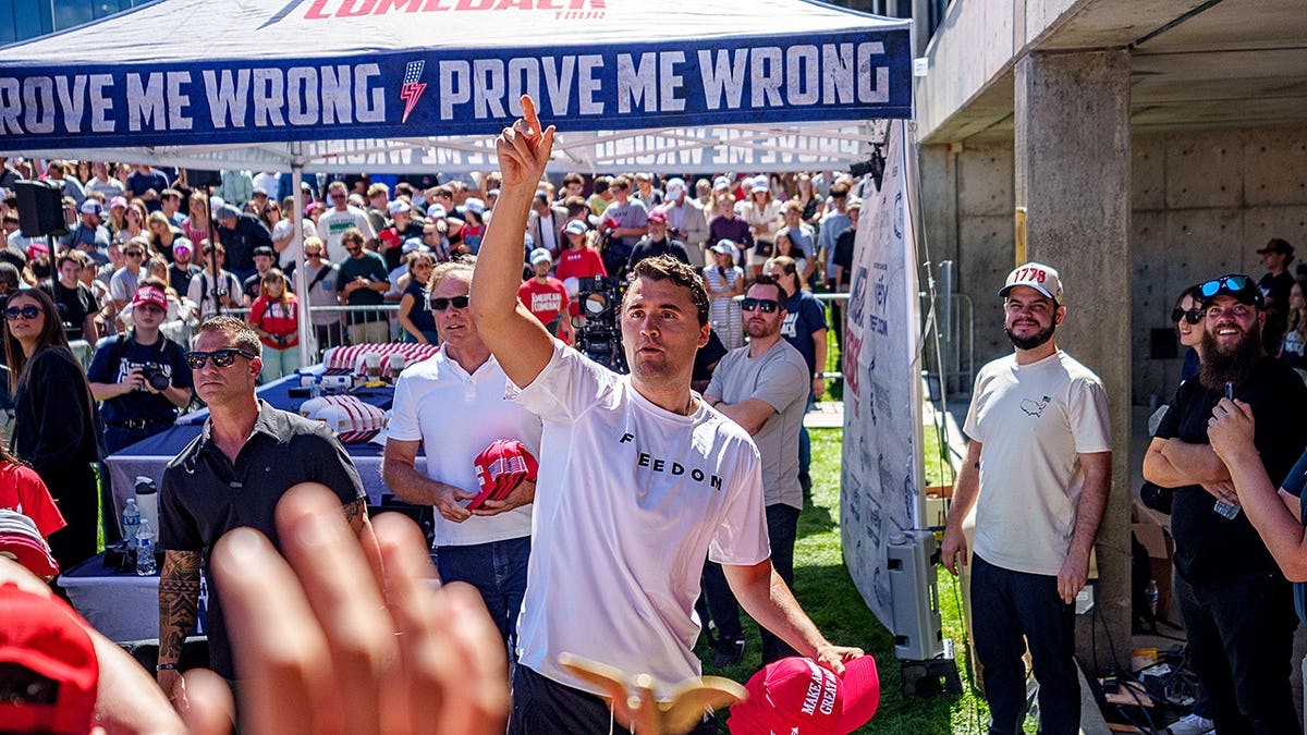 Charlie Kirk throwing hats to crowd at Utah Valley University in Orem Utah.