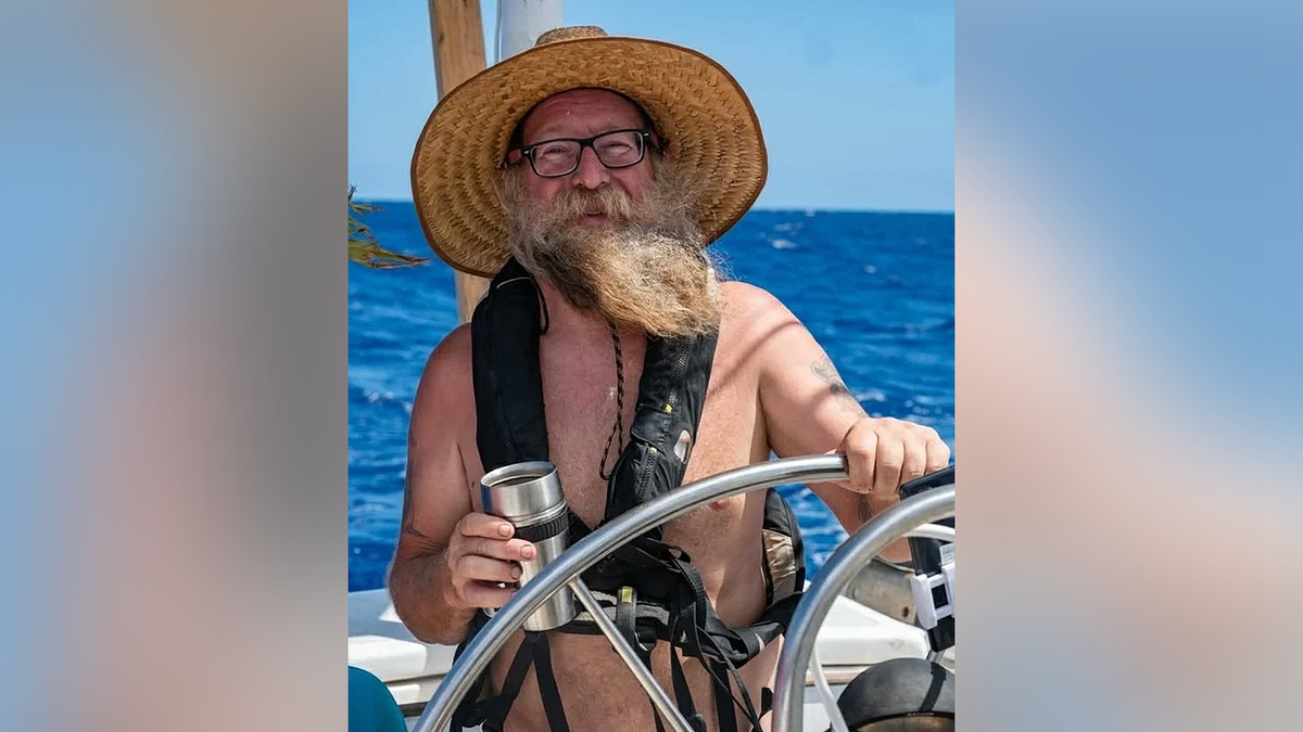 Donald Steven Lang at the helm of a sailboat in an FBI photograph