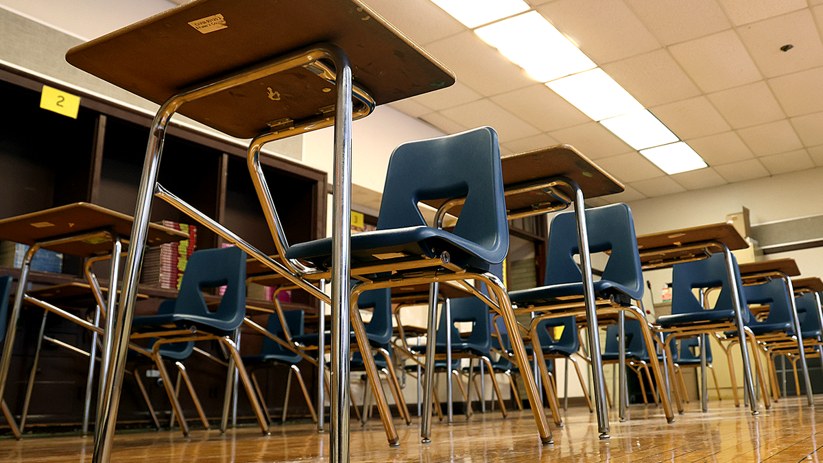 Empty blue classroom seats and desks