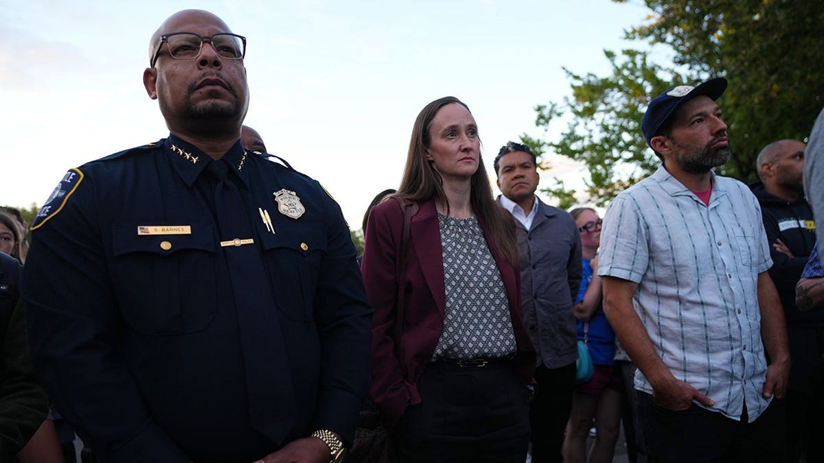 Seattle Mayor Katie Wilson and Police Chief Shon Barnes stand at a vigil in Seattle.